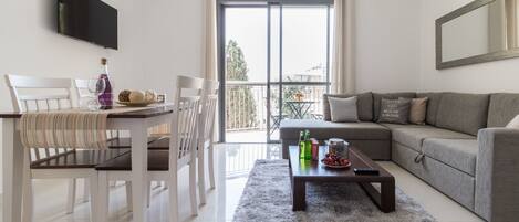 Comfort Apartment, 1 Bedroom | Living area | Flat-screen TV