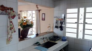 Family Apartment, 1 Queen Bed, Smoking | Private kitchen | Full-size fridge, oven, stovetop, cookware/dishes/utensils