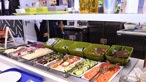 A buffet with various food options, including salads, vegetables, and meats. - Ibis Budget Wroclaw Stadion (Wroclaw)