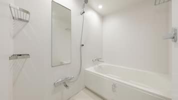 Combined shower/tub, free toiletries, hair dryer, slippers