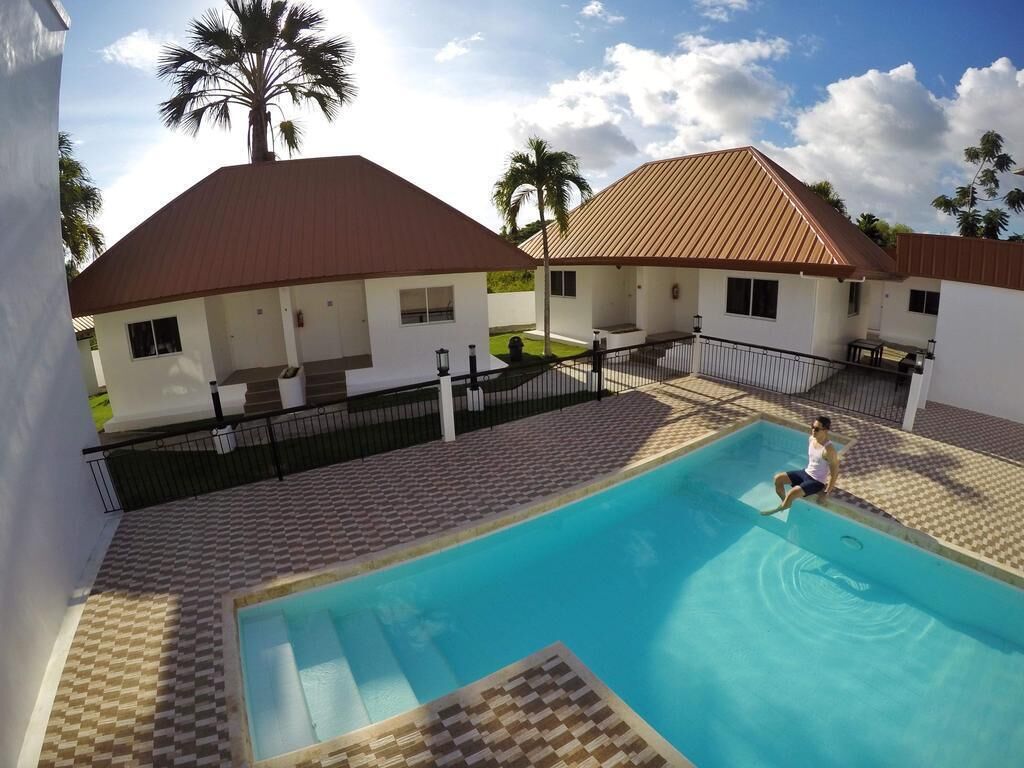 outdoor pool, open 8:00 am to 10:00 pm, pool umbrellas, pool loungers