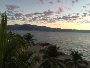 looking out window of room in am