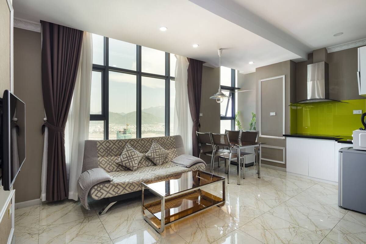 Deluxe Apartment, Partial Sea View | In-room safe, desk, blackout curtains, soundproofing