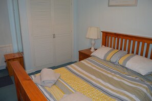 Double bedroom showing the large fitted wardrobe