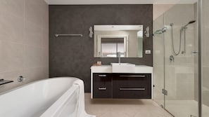 Bathtub, hair dryer, towels, soap