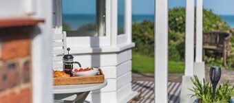 A luxury coastal holiday home with panoramic views of the English Channel