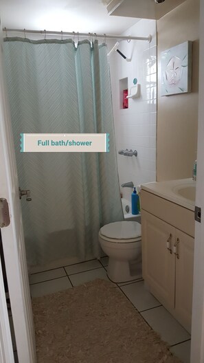 Combined shower/tub, hair dryer, towels, toilet paper