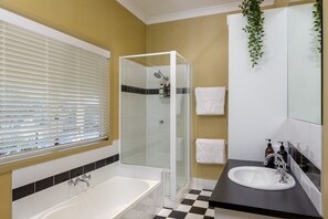 Bathtub, hair dryer, towels, soap