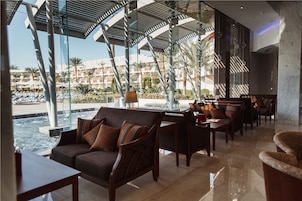 3 bars/lounges, swim-up bar, poolside bar, beach bar
