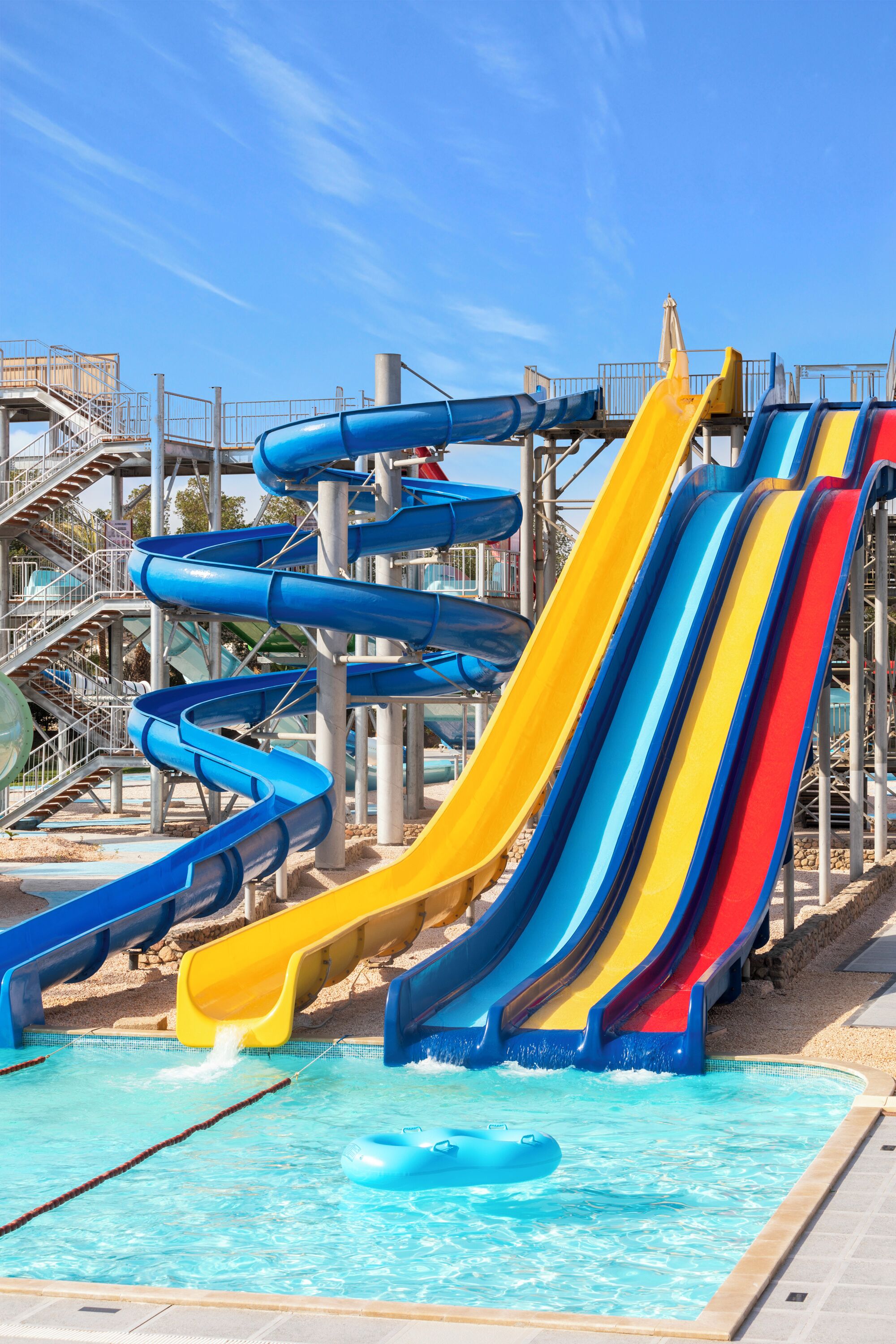 A water park with multiple slides and a pool area.