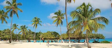 On the beach, sun-loungers, beach towels