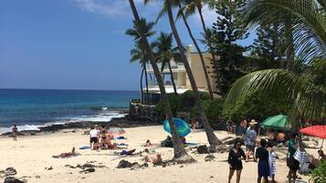 On the beach, sun loungers, beach towels