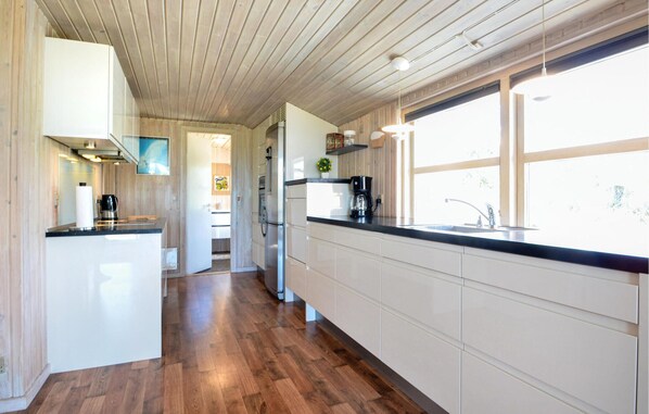 Fridge, stovetop, dishwasher, coffee/tea maker