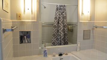 Combined shower/tub, hair dryer, towels, soap