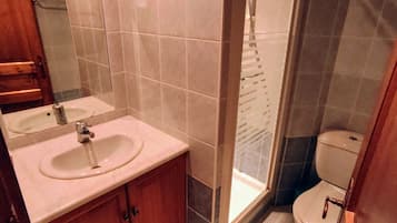 Shower, hair dryer, soap, toilet paper