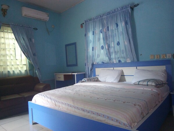 Minibar, desk, bed sheets