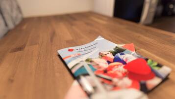 A brochure on a wooden table.