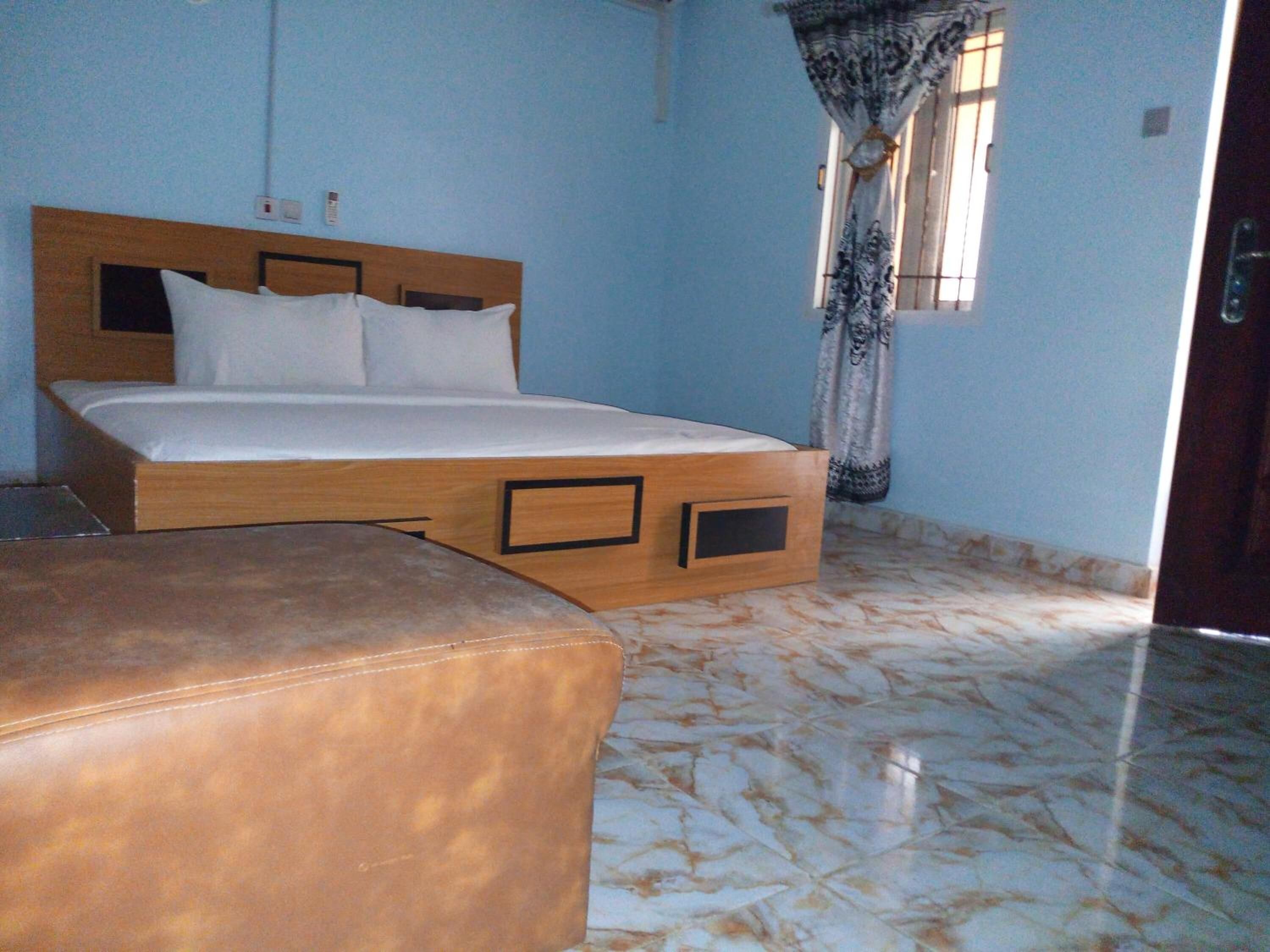 Desk, laptop workspace, bed sheets