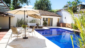 Outdoor pool, open 8:00 AM to 6:00 PM, pool umbrellas, pool loungers