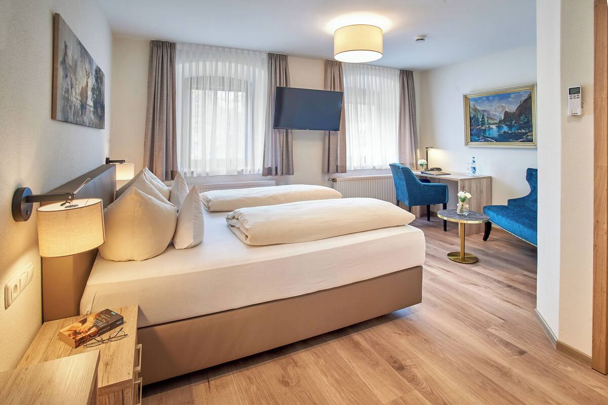 comfort double room (theresia) | hypo-allergenic bedding, desk, laptop workspace, blackout curtains
