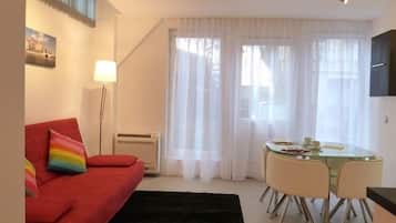 Studio, garden view- free parking | Living area | Flat-screen TV