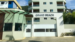 A multi-story building with a sign reading "GRAND BEACH". - Condomínio Residencial Grand Beach (Ubatuba)