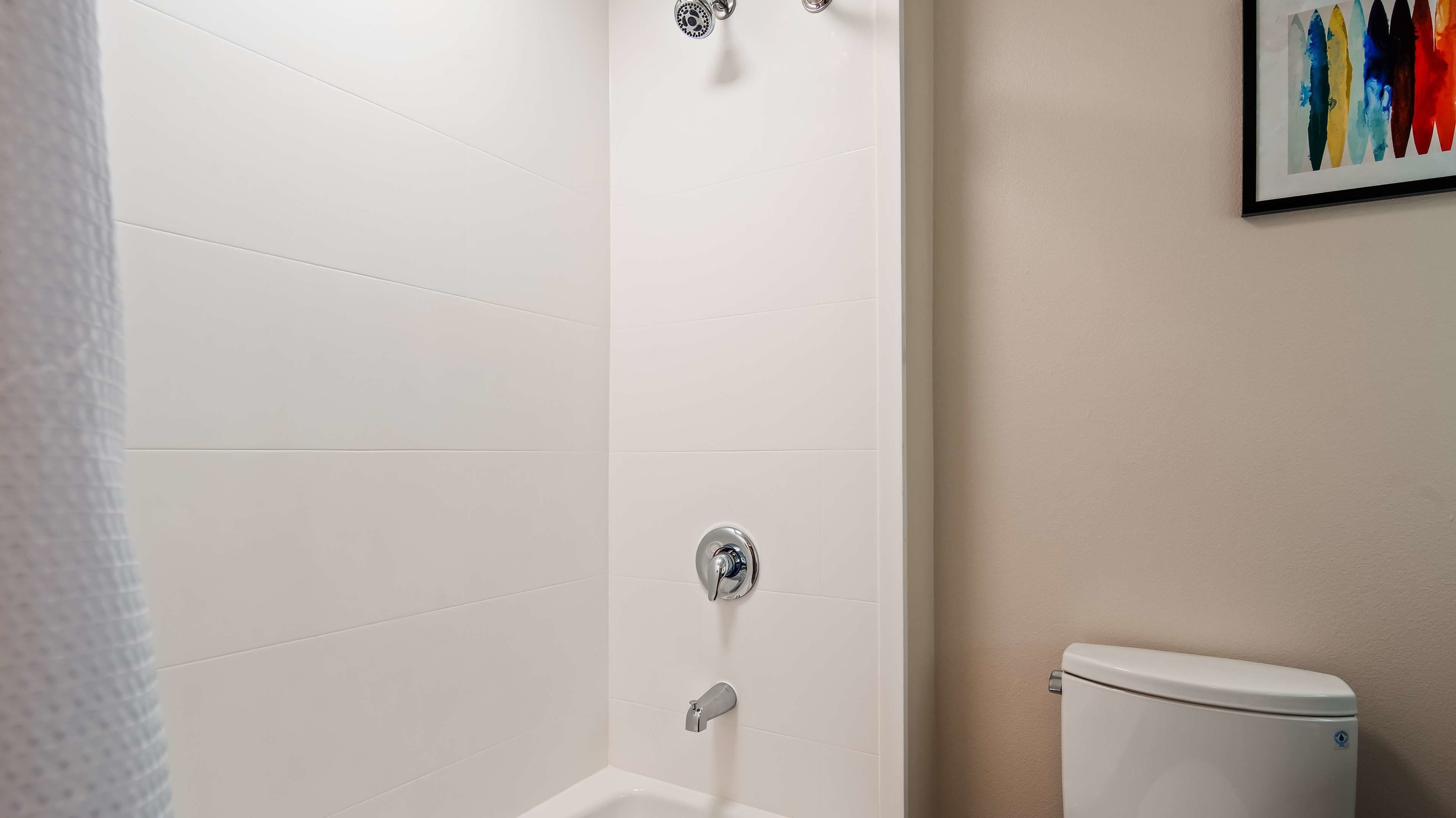 combined shower/bathtub, rainfall showerhead, hair dryer, towels