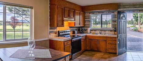 House (1 Bedroom) | Private kitchen | Full-sized fridge, microwave, oven, stovetop
