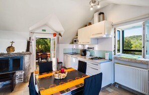 Fridge, stovetop, dishwasher, coffee/tea maker