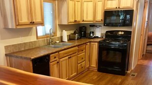 Espresso maker, full-sized fridge, microwave, oven