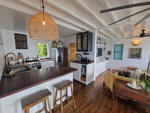 Fridge, microwave, coffee/tea maker, cookware/dishes/utensils