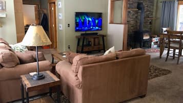 Chalet (2 Bedrooms) | Living area | TV, fireplace