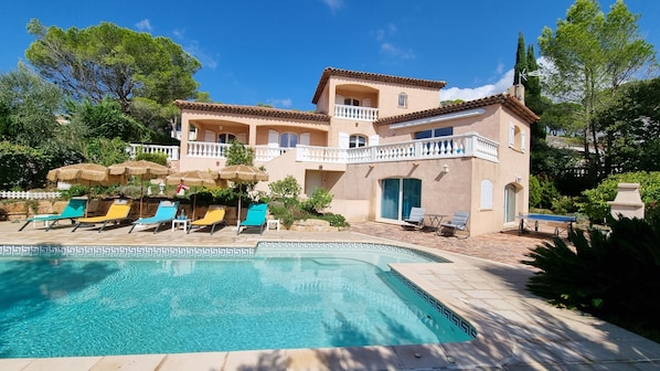 Relax in style with a pool and scenic views of lush surroundings.