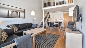 A modern apartment with a living room, dining area, kitchenette, and a balcony. - Awesome apartment in Faaborg with WiFi (Faaborg)