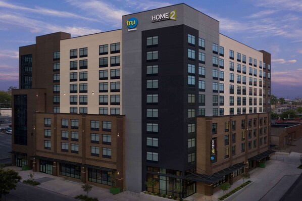 A multi-story hotel with a modern design, featuring a prominent 'HOME 2' sign on the facade. - Tru by Hilton Nashville Downtown Convention Center (Nashville)
