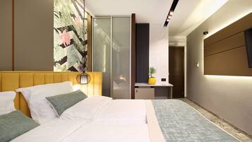 Select Comfort beds, minibar, in-room safe, desk