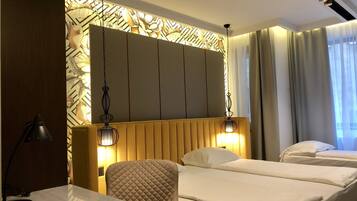 Triple Room | Select Comfort beds, minibar, in-room safe, desk