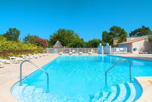 Seasonal outdoor pool, pool umbrellas, pool loungers