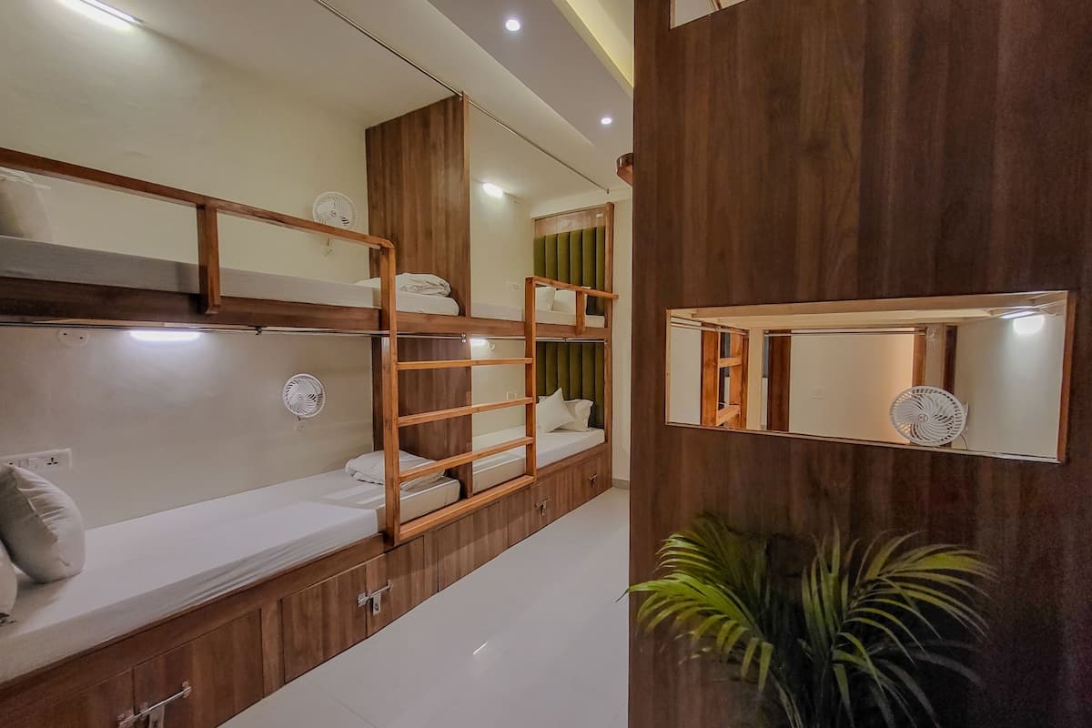 Bed in 6 Bed Premium Female AC | Premium bedding, blackout drapes, free WiFi, bed sheets