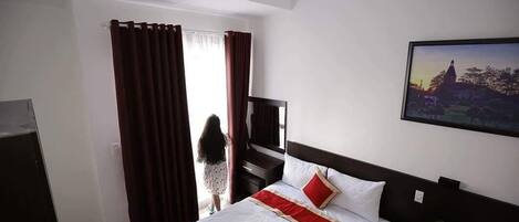 Deluxe Family Room, Balcony | Minibar, desk, blackout drapes, iron/ironing board