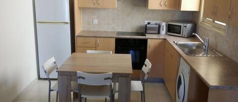 Apartment, 2 Bedrooms | Private kitchen | Full-size fridge, microwave, oven, stovetop