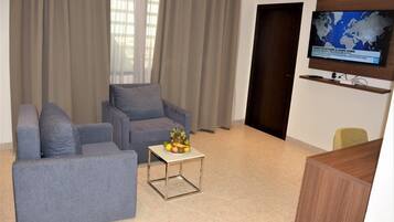 Suite | Living area | 40-inch LCD TV with satellite channels, TV