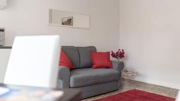 Apartment, 1 Bedroom | Living room | Flat-screen TV