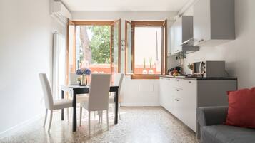 Apartment, 1 Bedroom | Living room | Flat-screen TV
