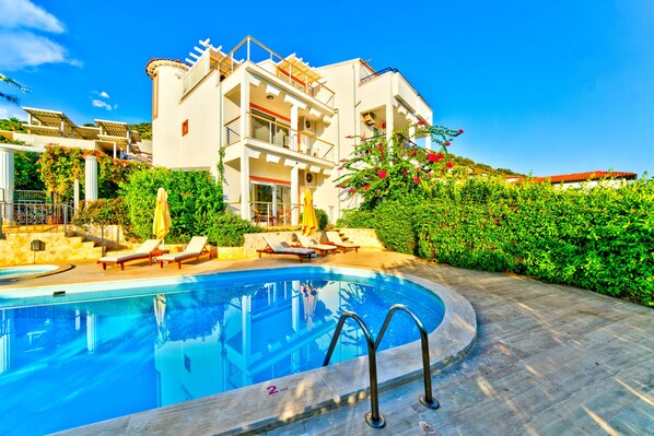 Outdoor pool, pool umbrellas, pool loungers