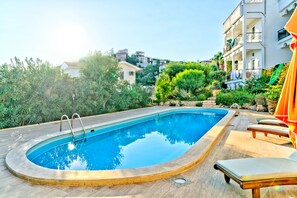 Outdoor pool, pool umbrellas, pool loungers