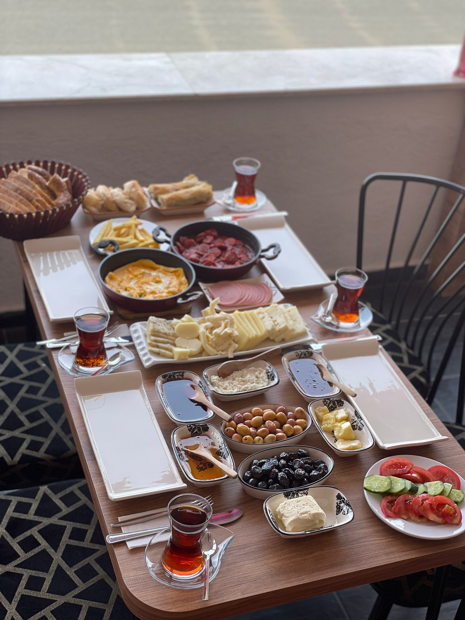 A table set with various dishes and drinks, likely for a meal.