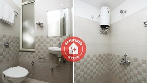 A bathroom with a toilet, sink, and shower. - OYO 12682 Hotel Relax (Gwalior)