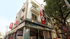 A hotel with multiple floors, balconies, and a prominent 'OYO' sign. - OYO 12682 Hotel Relax (Gwalior)