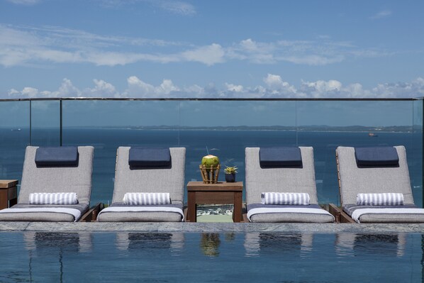 Outdoor pool, open 9:00 AM to 9:00 PM, pool loungers